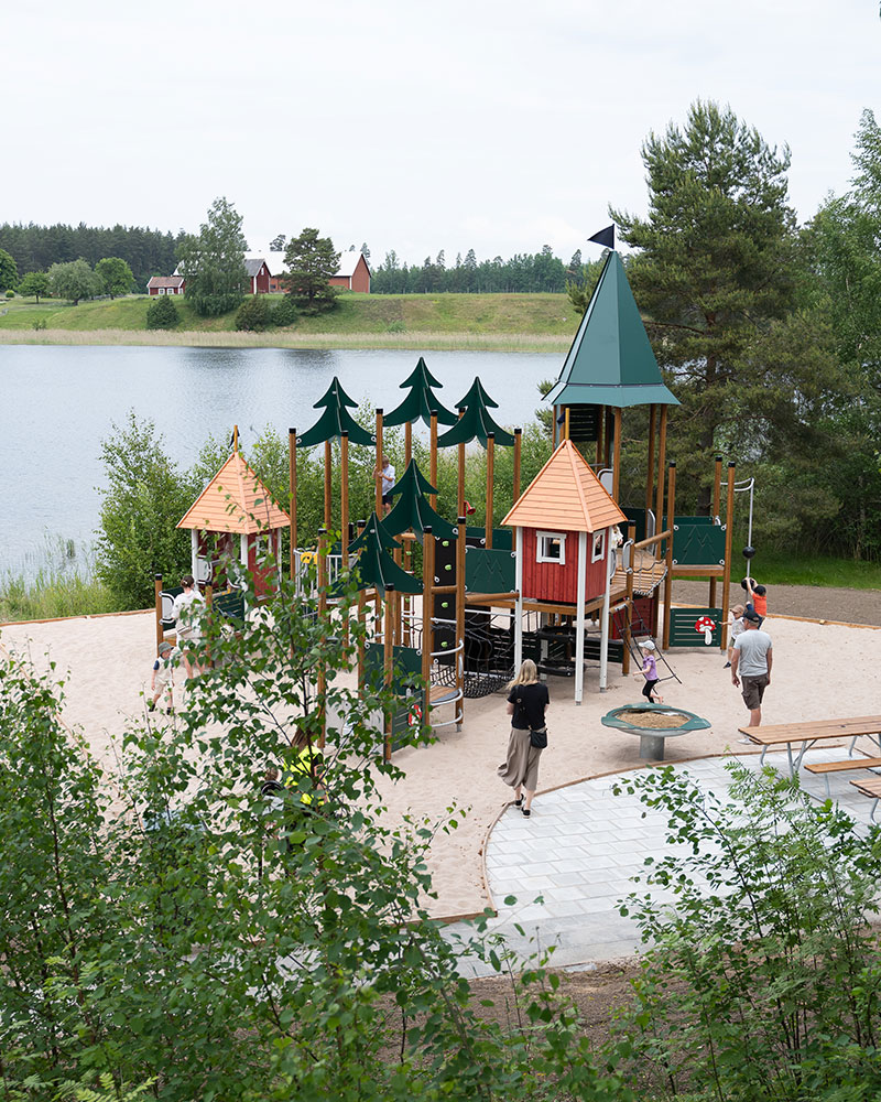 Forest themed playground unit by a lake in sweden.